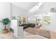 Bright and airy living room boasts high ceilings, a fireplace, and a seamless flow to the dining area at 179 Adomeit Dr, Henderson, NV 89074
