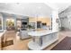 An open-concept living area features a bright kitchen with stainless appliances and a dining area at 179 Adomeit Dr, Henderson, NV 89074