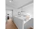 Bright upstairs loft showcasing neutral colors, a ceiling fan, and staircase access at 179 Adomeit Dr, Henderson, NV 89074
