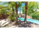 Lush landscaping surrounds the pool, creating a private retreat with a rock waterfall feature at 179 Adomeit Dr, Henderson, NV 89074