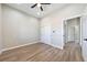 Bedroom with a view, wood-look floors, and closet with sliding doors at 1800 Huckleberry St, Pahrump, NV 89048