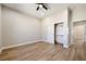 Spacious bedroom features wood-look floors and a closet with sliding doors at 1800 Huckleberry St, Pahrump, NV 89048