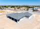 Rear aerial view showcasing a large rear patio of the single story home at 1800 Huckleberry St, Pahrump, NV 89048