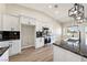 A kitchen is furnished with an island, stainless steel appliances, and sleek granite countertops at 1800 Huckleberry St, Pahrump, NV 89048
