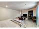Bedroom showcasing tiled floors, neutral walls, lighting, desk and a queen size bed at 2402 Saguaro Point St, Las Vegas, NV 89115