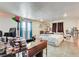 Cozy bedroom features tile floors, bright lights, an air conditioner and room to personalize at 2402 Saguaro Point St, Las Vegas, NV 89115