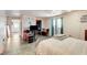 Bedroom featuring tiled floors, modern lighting and a window perfect for natural light at 2402 Saguaro Point St, Las Vegas, NV 89115
