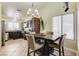 Eat-in kitchen with stylish lighting, modern appliances, tile flooring, and ample counter space at 2402 Saguaro Point St, Las Vegas, NV 89115