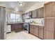 Well-equipped kitchen boasts stainless steel appliances, tile flooring, and ample cabinetry at 2402 Saguaro Point St, Las Vegas, NV 89115