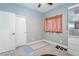 Bedroom with neutral paint, fitness equipment, closet, and window at 2421 Sunrise Springs Ct, North Las Vegas, NV 89031