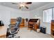 Bedroom featuring a ceiling fan, wooden desk, bookcase, and chair at 2541 Desert Glen Dr, Las Vegas, NV 89134