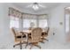 Eat-in kitchen area with a ceiling fan and floral valance curtains at 2541 Desert Glen Dr, Las Vegas, NV 89134