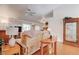 Large open living room with ceiling fan, hardwood floors, and a large sofa and display case at 2541 Desert Glen Dr, Las Vegas, NV 89134