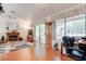 Bright living room featuring a fireplace, laminate flooring, and sliding glass doors to backyard at 2541 Desert Glen Dr, Las Vegas, NV 89134