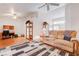 Spacious living room with ceiling fan and hardwood floors, with a plush sofa and well-lit space at 2541 Desert Glen Dr, Las Vegas, NV 89134
