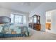 Bedroom featuring a large bay window, vaulted ceiling and dresser at 2541 Desert Glen Dr, Las Vegas, NV 89134