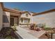 A cozy front patio with a table and chairs, perfect for relaxing and enjoying the outdoors at 2541 Desert Glen Dr, Las Vegas, NV 89134