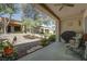 The covered patio provides a relaxing outdoor space with views of the landscaped backyard at 2541 Desert Glen Dr, Las Vegas, NV 89134