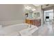 Bright bathroom featuring a dual sink vanity, bathtub, and lots of natural light at 2555 Hampton Rd # 5104, Henderson, NV 89052