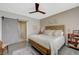Bedroom with ceiling fan, barn door, and a well-lit interior with stylish decor at 2555 Hampton Rd # 5104, Henderson, NV 89052