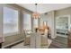 Charming dining room with a round table, chandelier lighting, and natural light from the window at 2555 Hampton Rd # 5104, Henderson, NV 89052
