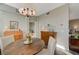 Charming dining area with a wooden dresser, and natural light from the adjacent room at 2555 Hampton Rd # 5104, Henderson, NV 89052
