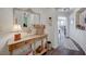 Inviting entryway featuring a rustic wooden console table with decorative accents at 2555 Hampton Rd # 5104, Henderson, NV 89052