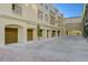 Exterior view featuring private garages in a well-maintained community at 2555 Hampton Rd # 5104, Henderson, NV 89052