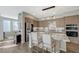 Well-lit kitchen featuring granite countertops, stainless steel appliances, and a breakfast bar with seating at 2555 Hampton Rd # 5104, Henderson, NV 89052