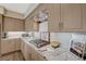 Close up of the granite countertops, cooktop, backsplash, and cabinetry at 2555 Hampton Rd # 5104, Henderson, NV 89052