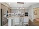 Elegant kitchen with granite island, stainless appliances, gray cabinets, and pendant lights at 2555 Hampton Rd # 5104, Henderson, NV 89052