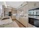 Modern kitchen featuring stainless steel appliances, sleek cabinetry, and wood-look flooring at 2555 Hampton Rd # 5104, Henderson, NV 89052