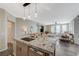 Bright kitchen features a speckled granite island, stainless steel appliances, and pendant lighting at 2555 Hampton Rd # 5104, Henderson, NV 89052