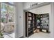 Cozy community library nook with a large selection of books and a serene outdoor view at 2555 Hampton Rd # 5104, Henderson, NV 89052