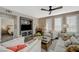 Inviting living room features a cozy fireplace and plenty of natural light from the shuttered windows at 2555 Hampton Rd # 5104, Henderson, NV 89052
