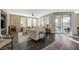 Inviting living room featuring a fireplace, dark floors, neutral decor, and an access to the outdoors at 2555 Hampton Rd # 5104, Henderson, NV 89052