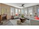 Cozy living room featuring a fireplace, neutral paint, and plantation shutters for privacy at 2555 Hampton Rd # 5104, Henderson, NV 89052