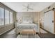 Bright main bedroom with four-poster bed, ceiling fan, and shuttered windows at 2555 Hampton Rd # 5104, Henderson, NV 89052