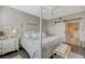 Bedroom featuring a stylish four-poster bed, barn door, and ensuite bathroom at 2555 Hampton Rd # 5104, Henderson, NV 89052