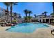 Resort-style pool surrounded by lush landscaping and comfortable seating at 2555 Hampton Rd # 5104, Henderson, NV 89052