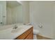 Bathroom with wood vanity, a large mirror, white toilet, and shower at 2786 Fountain Ridge Ln, Henderson, NV 89074
