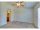 Bright bedroom featuring neutral carpet, ceiling fan, and ensuite bath access at 2786 Fountain Ridge Ln, Henderson, NV 89074