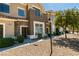 Charming townhouse with stone accents, manicured landscaping, and warm neutral colors at 2786 Fountain Ridge Ln, Henderson, NV 89074