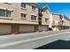 Modern apartment complex exterior showcasing garages and neutral-toned facade at 2786 Fountain Ridge Ln, Henderson, NV 89074