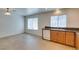 Bright kitchen area with tile flooring, granite countertops, and modern appliances at 2786 Fountain Ridge Ln, Henderson, NV 89074