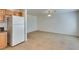Open kitchen area with tile floor, white appliances, and ample natural light at 2786 Fountain Ridge Ln, Henderson, NV 89074