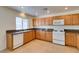 Kitchen with tile flooring, granite counters, bright recessed lighting, and stainless steel sink at 2786 Fountain Ridge Ln, Henderson, NV 89074