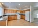 Bright kitchen featuring granite counters, tile floor, recessed lighting, and ample cabinet space at 2786 Fountain Ridge Ln, Henderson, NV 89074