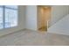 Neutral carpeted room with large window, white trim, and a view of the outside at 2786 Fountain Ridge Ln, Henderson, NV 89074
