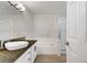 Bathroom with dark countertops, modern lighting, and separate tub and shower at 2925 Wigwam Pkwy # 1021, Henderson, NV 89074